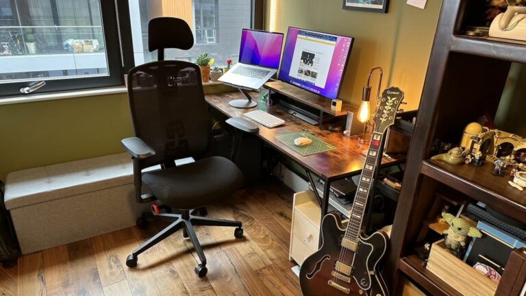 The Herman Miller x Logitech G Vantum gaming chair in a bedroom office with wooden floor and desk.