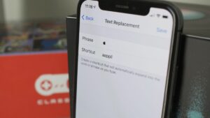 an iPhone with text replacement