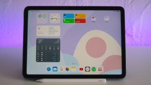 iPad Air 5 on a desk, showing widgets.