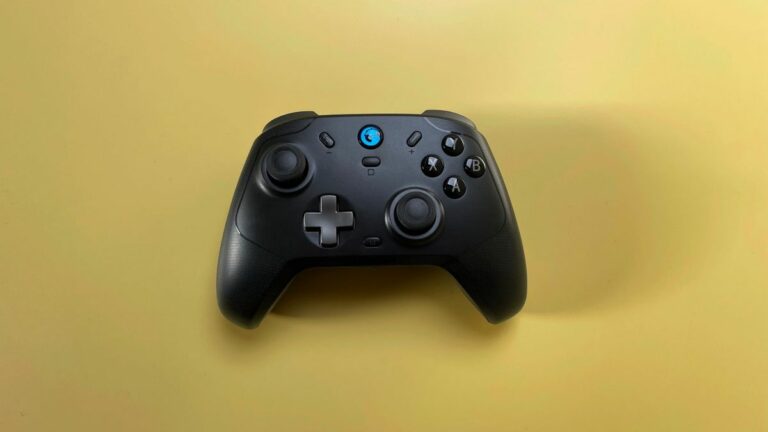 The GameSir T4 Cyclone Pro game controller for iOS and macOS against a yellow background.