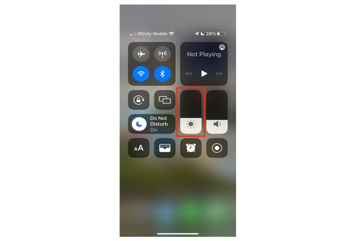 Controle deslizante de brilho do iOS Control Center.