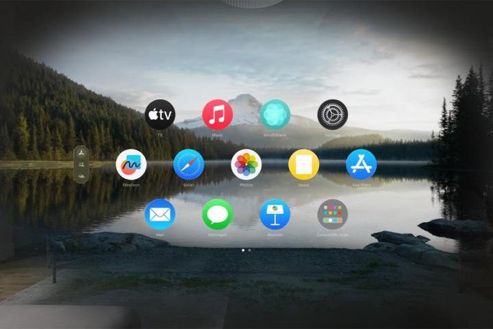 Um conjunto de ícones de aplicativos aparece contra um lago e montanhas como pano de fundo usando o recurso Ambientes no fone de ouvido Vision Pro da Apple.