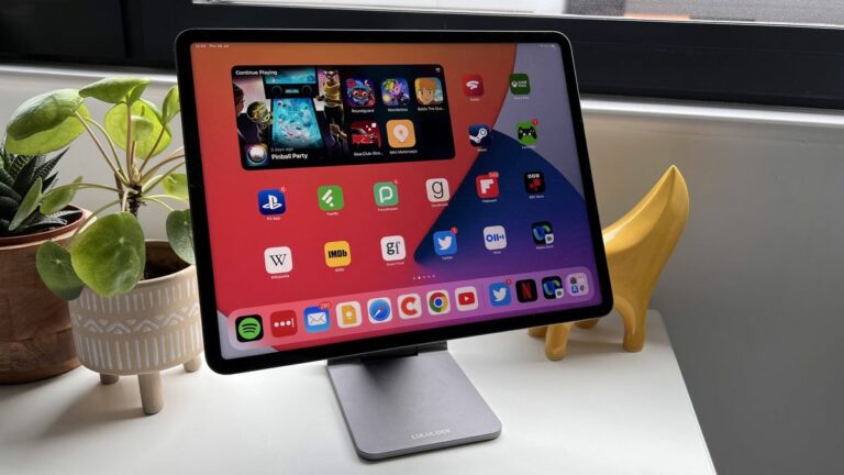 Lululook Foldable Magnetic iPad Stand on a bedside table with iPad Pro